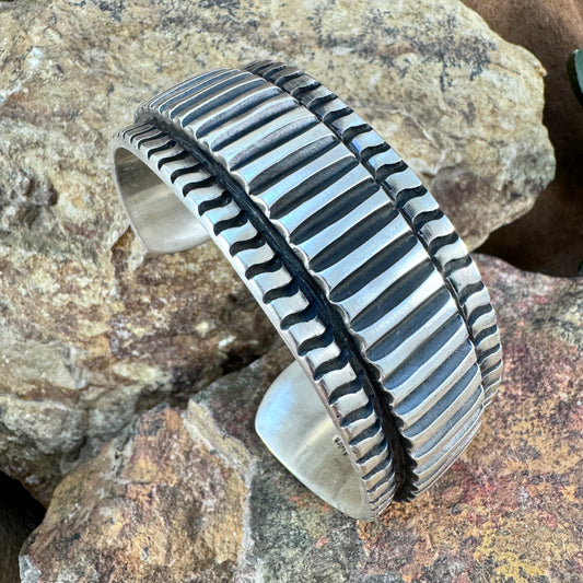 Sterling Silver Ribbed Cuff Bracelet with Hidden Sunburst Design by Elvira Bill