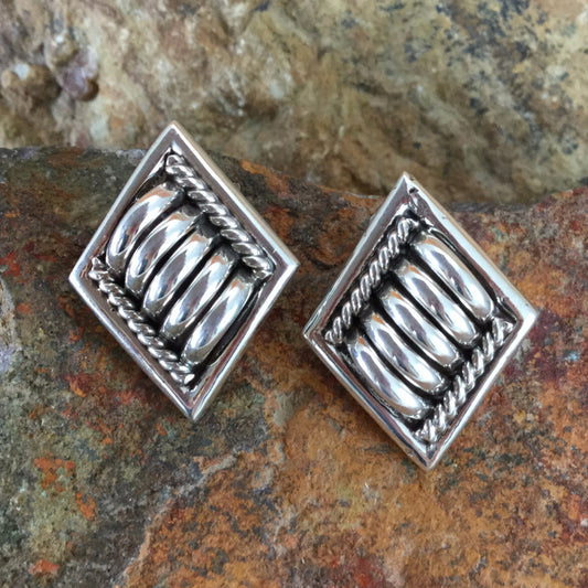 Traditional Sterling Silver Earrings by Tom Charlie